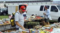 Shoppers and collectors sort through some of the more than 7,500 vendor spaces during opening day at the Charlotte AutoFair.