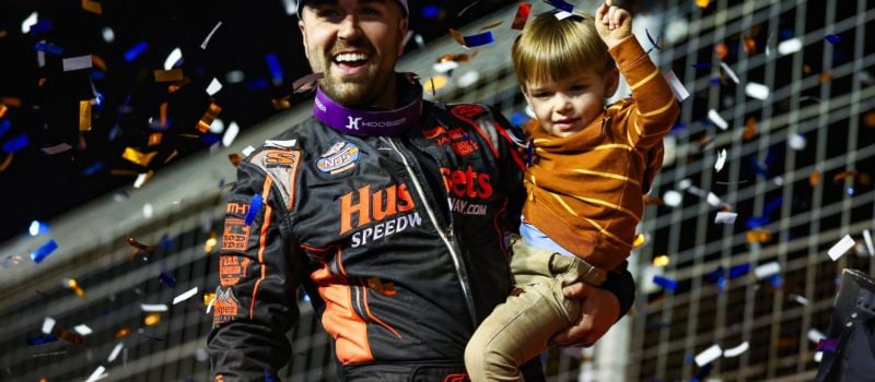 David Gravel celebrates in Victory Lane with his son after winning Friday's NOS Energy Drink Sprint Car Series feature at the World of Outlaws World Finals