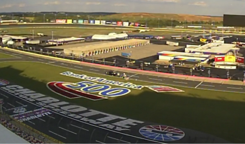 An Alan Jones-led crew paints the Bank of America 500 logo on Charlotte Motor Speedway's infield grass in advance of Saturday's Bank of America 500. 