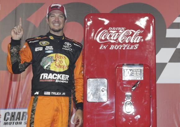 Martin Truex Jr. poses with a vintage, restored Coca-Cola machine from Remember When Restorations after winning last year's Coca-Cola 600 on May 29 at Charlotte Motor Speedway.