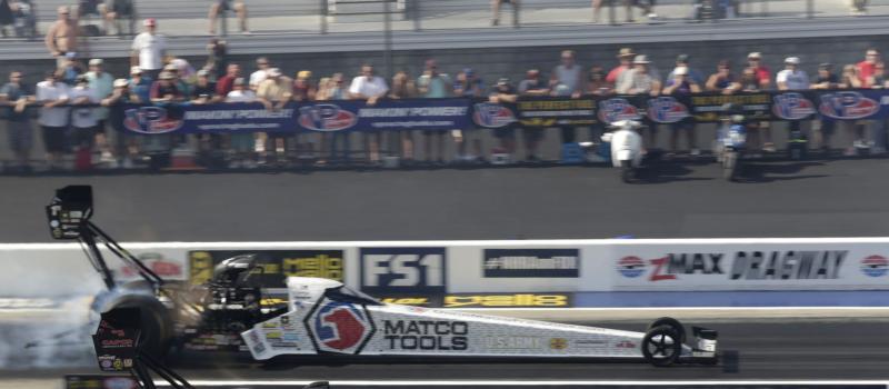 Top Fuel drivers Antron Brown and Steve Torrence power their 10,000-horsepower their dragsters down the strip during last year's NHRA Carolina Nationals at zMAX Dragway.